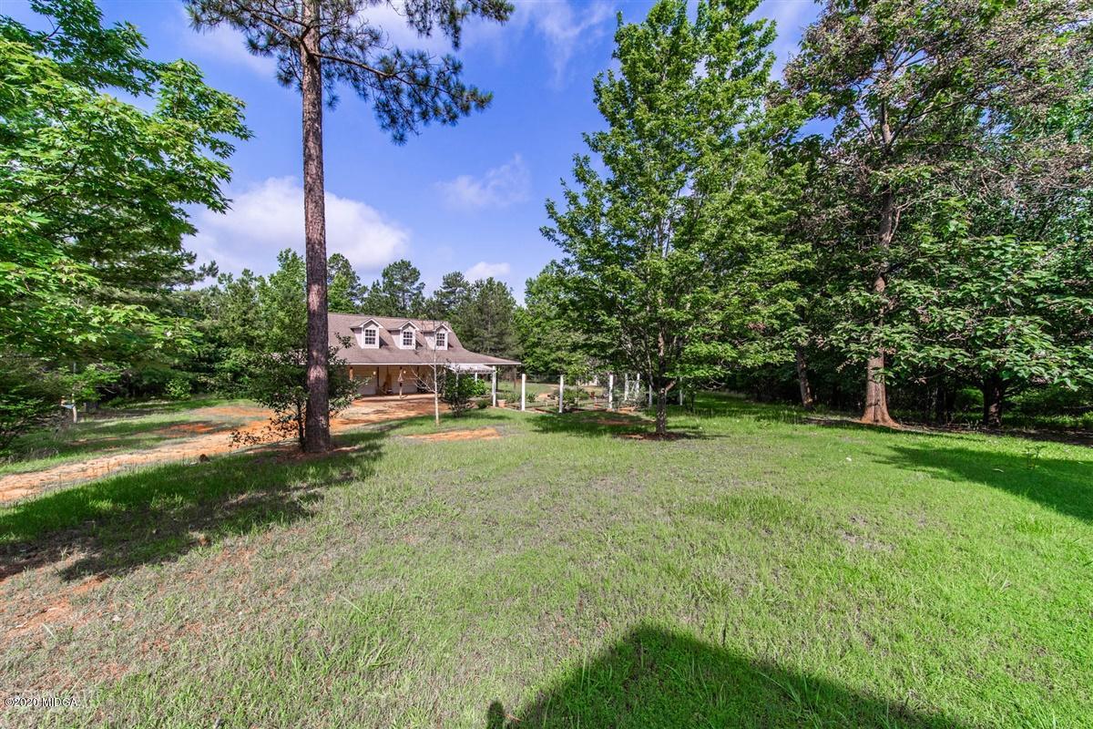 4271 Upper River Road Gray, GA 31032 - Photo 28 of 40 a view of a yard with a house in the background