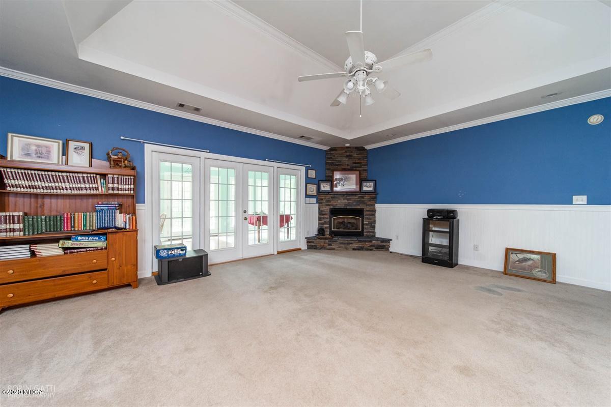 4271 Upper River Road Gray, GA 31032 - Photo 10 of 40 a view of a livingroom with furniture and workspace