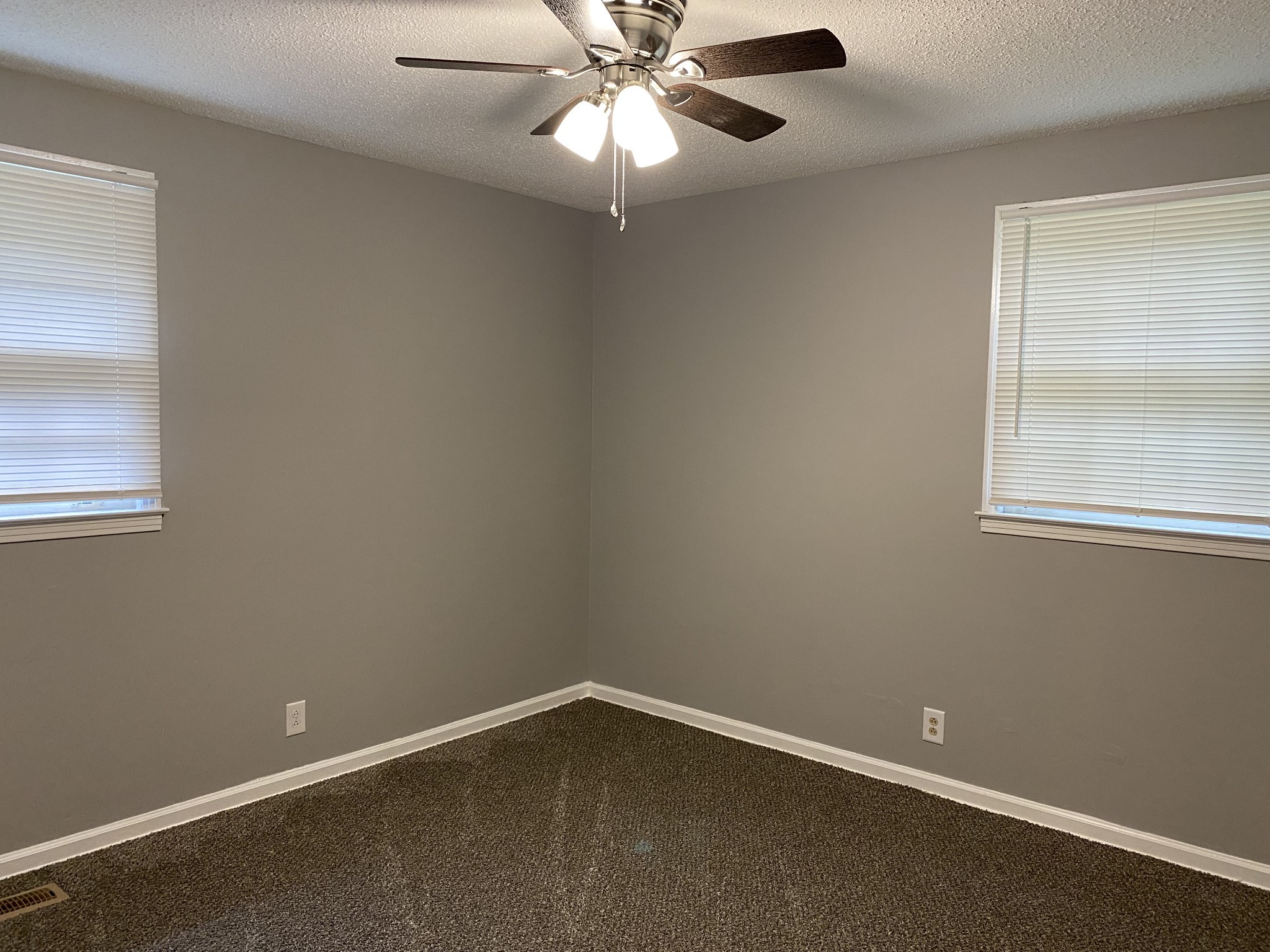 222 North 11th Street Clarksville, TN 37040 - Photo 9 of 14 an empty room with a window and a fan