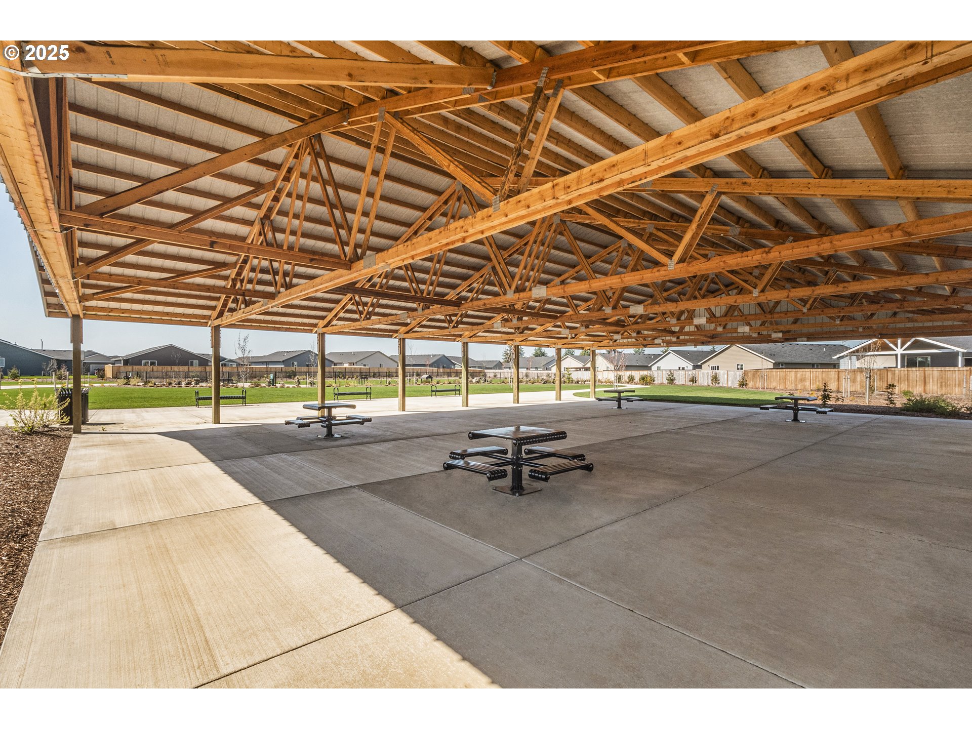 714 Merriott Lane Woodburn, OR 97071 - Photo 19 of 26 a view of a patio with a table and chairs
