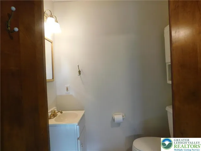 a bedroom with a bed and chair