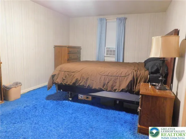 a room with furniture and a flat screen tv