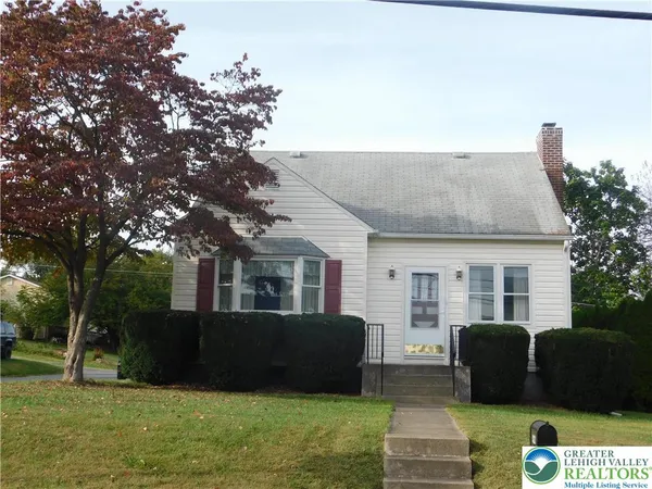 a view of house with yard
