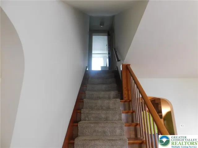 a kitchen with granite countertop wood cabinets and stainless steel appliances