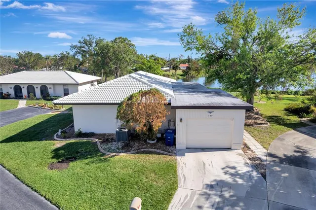 a aerial view of a house with a yard