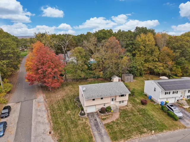 an aerial view of residential houses with outdoor space