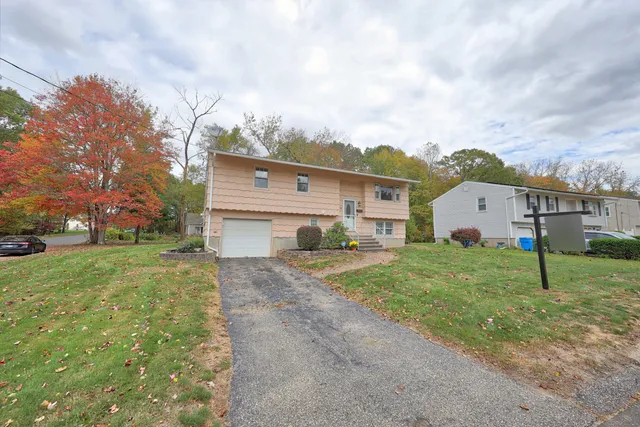 a view of a room with wooden floor and windows