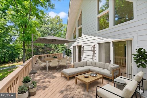 38620 Lime Kiln Road Leesburg, VA 20175 - Photo 12 of 87 a view of a patio with couches table and chairs and potted plants
