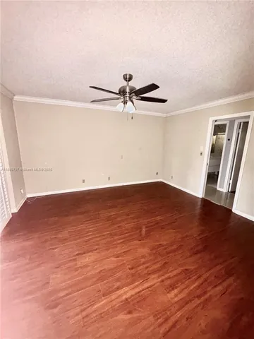 a kitchen with a sink a stove cabinets and utility room
