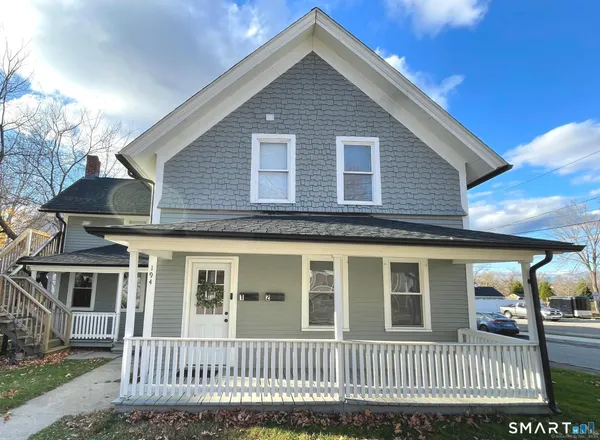 a front view of a house with a porch