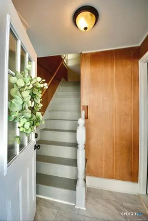 a view of entryway with wooden floor