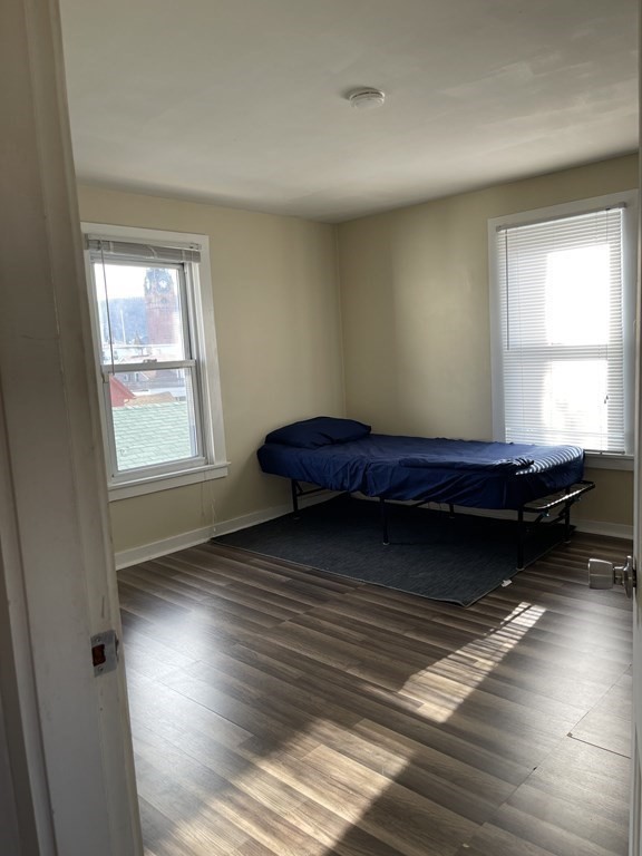 10 Eddy Street Ware, MA 01082 - Photo 12 of 20 a living room with a bed furniture and a window