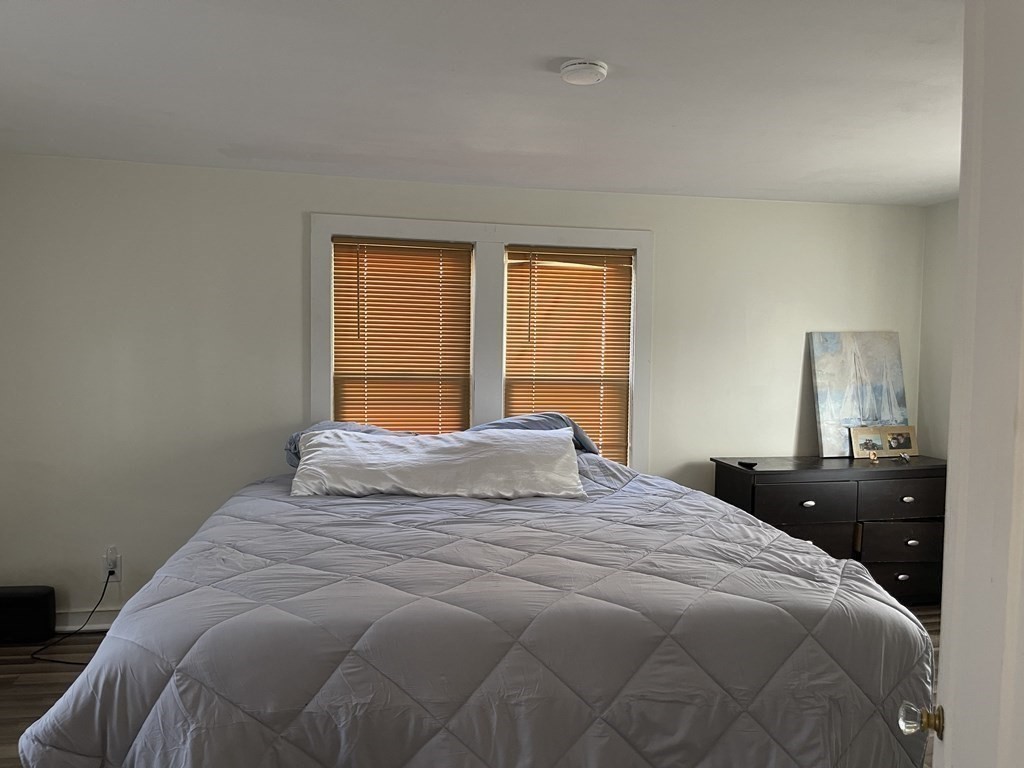 10 Eddy Street Ware, MA 01082 - Photo 13 of 20 a bedroom with a bed and a lamp