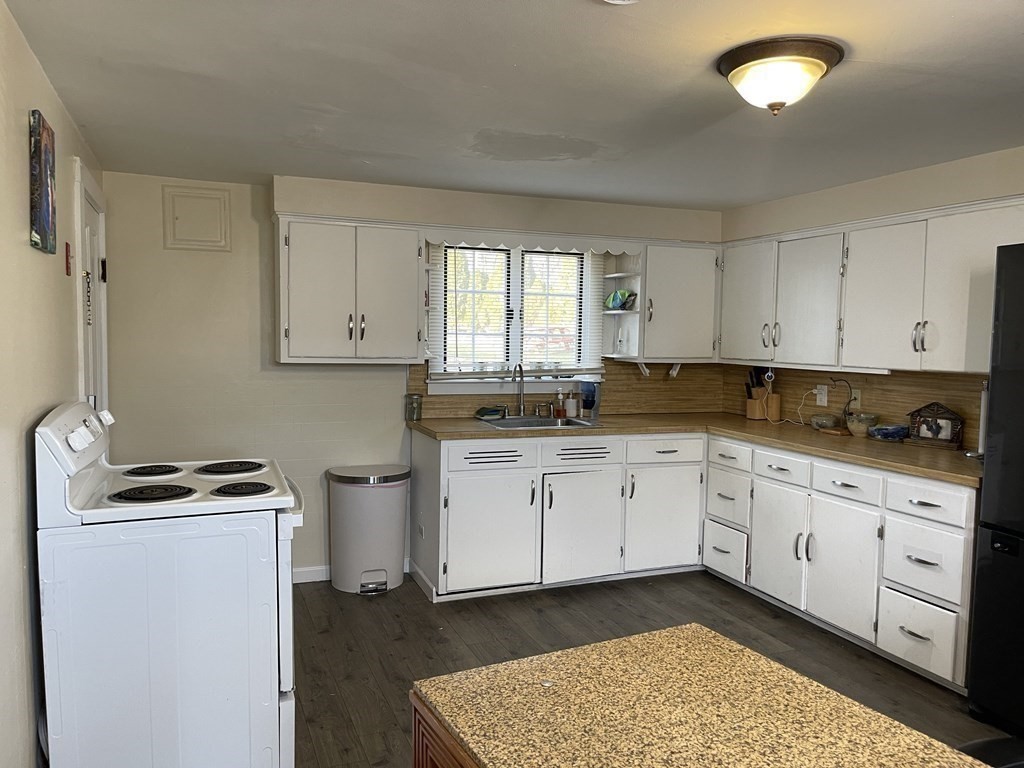 10 Eddy Street Ware, MA 01082 - Photo 7 of 20 a kitchen with sink window and cabinets