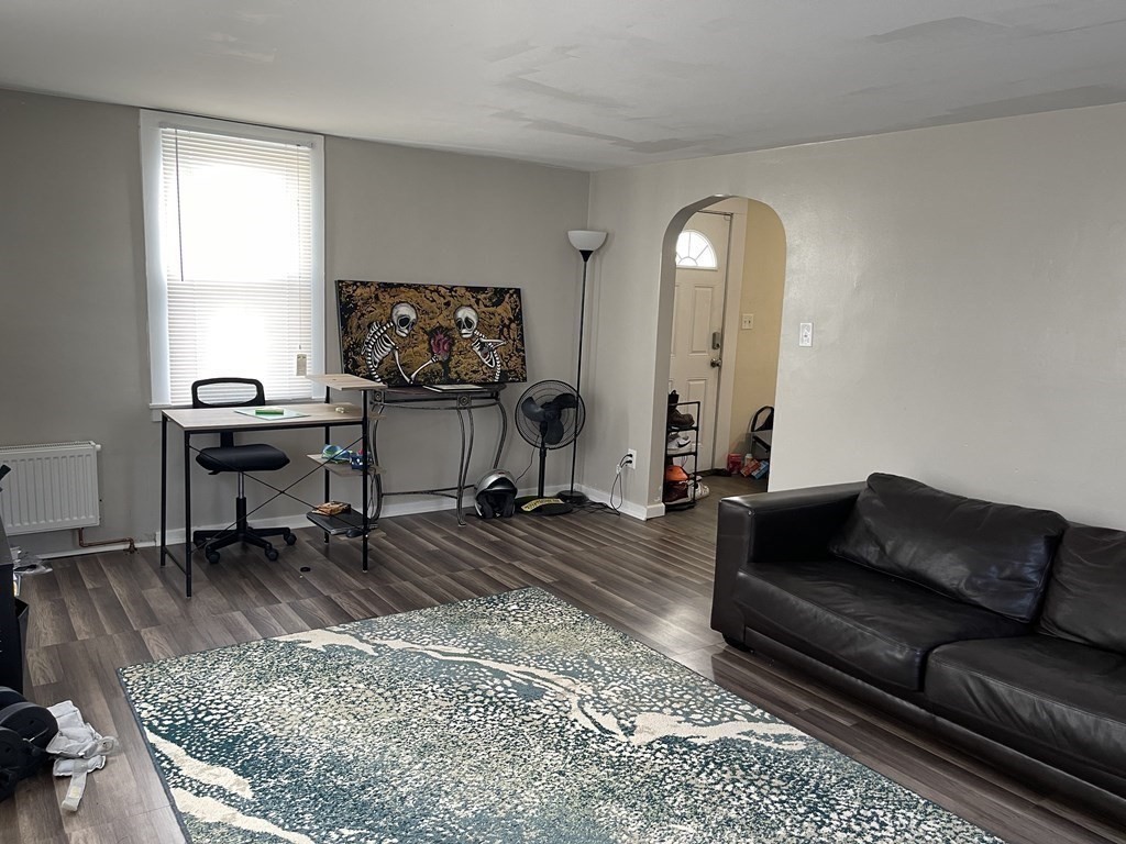 10 Eddy Street Ware, MA 01082 - Photo 8 of 20 a living room with furniture and a flat screen tv