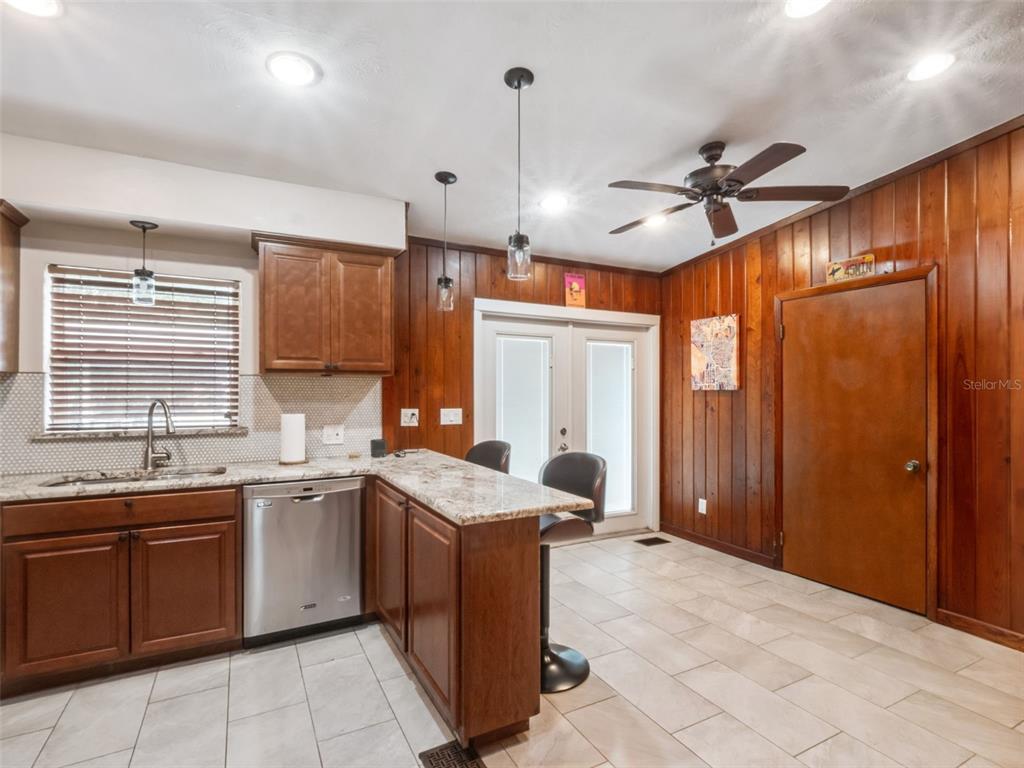 2819 Rogan Road Orlando, FL 32812 - Photo 11 of 28 a kitchen with a sink stove and cabinets