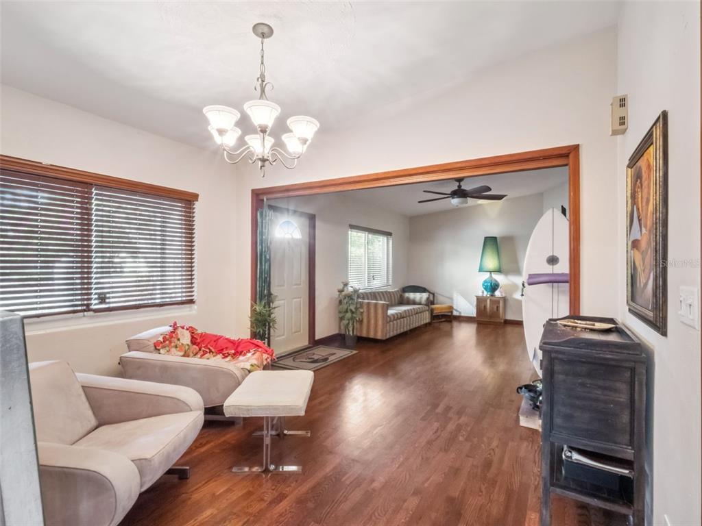 2819 Rogan Road Orlando, FL 32812 - Photo 13 of 28 a living room with furniture and a chandelier