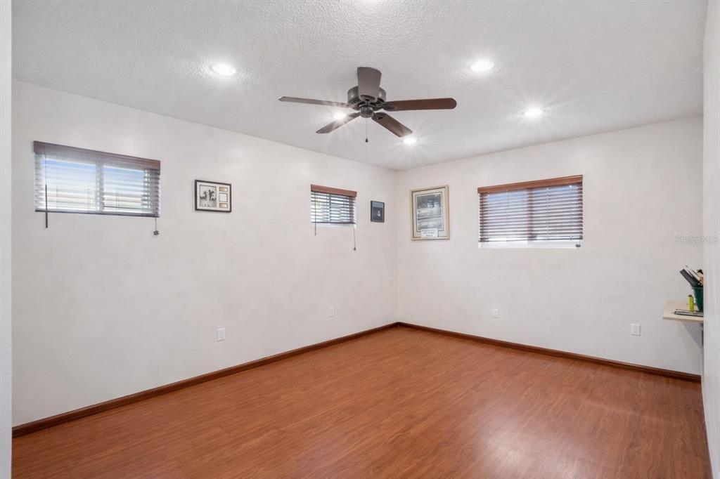 2819 Rogan Road Orlando, FL 32812 - Photo 17 of 28 a view of empty room with wooden floor