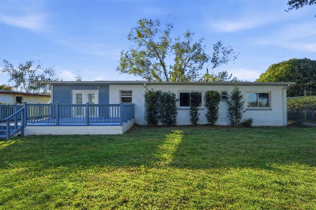 2819 Rogan Road Orlando, FL 32812 - Photo 21 of 28 a view of a house with a backyard