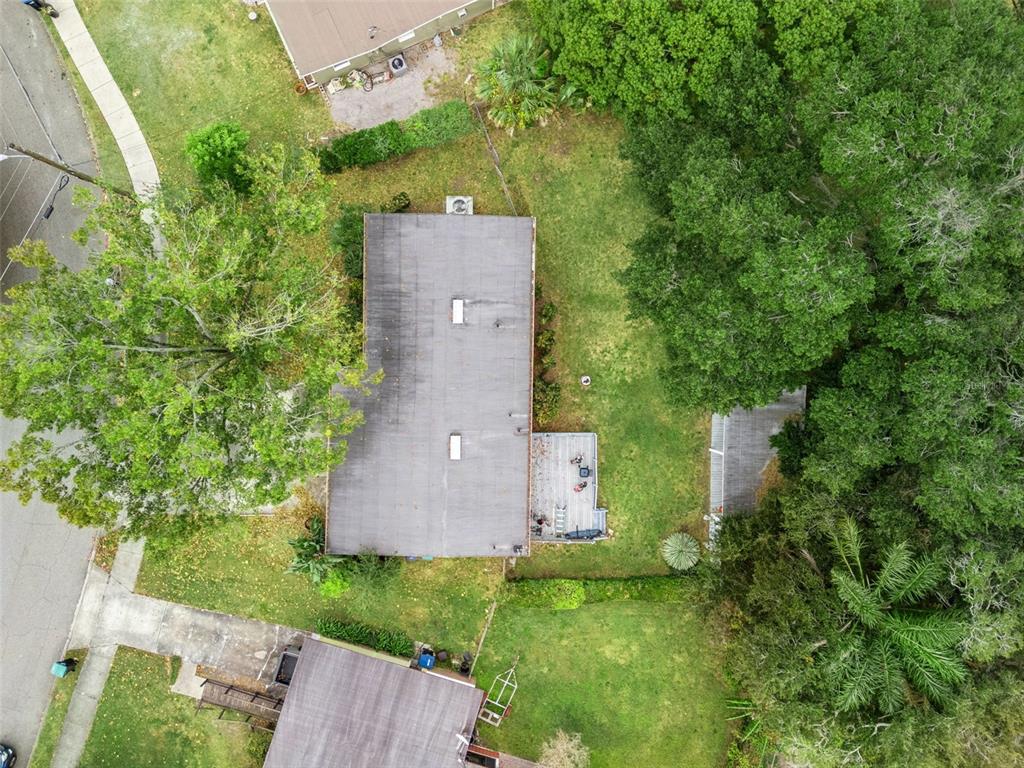 2819 Rogan Road Orlando, FL 32812 - Photo 26 of 28 an aerial view of a house with a yard and trees