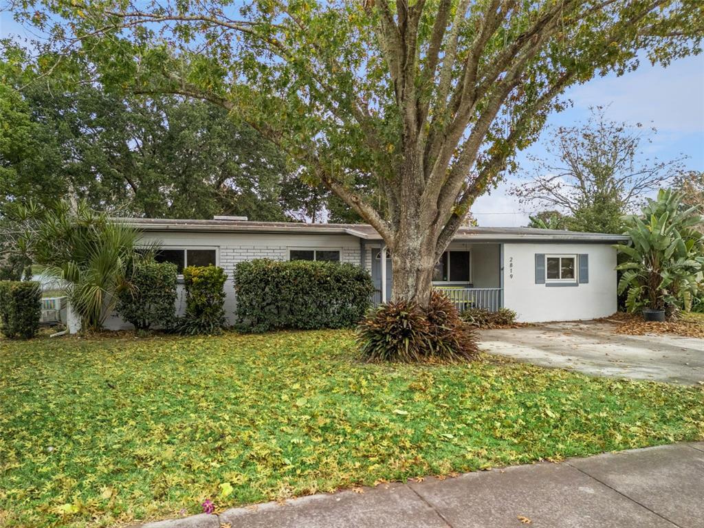2819 Rogan Road Orlando, FL 32812 - Photo 27 of 28 a front view of a house with garden