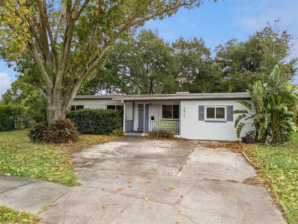 2819 Rogan Road Orlando, FL 32812 - Photo 28 of 28 a view of a house with a yard