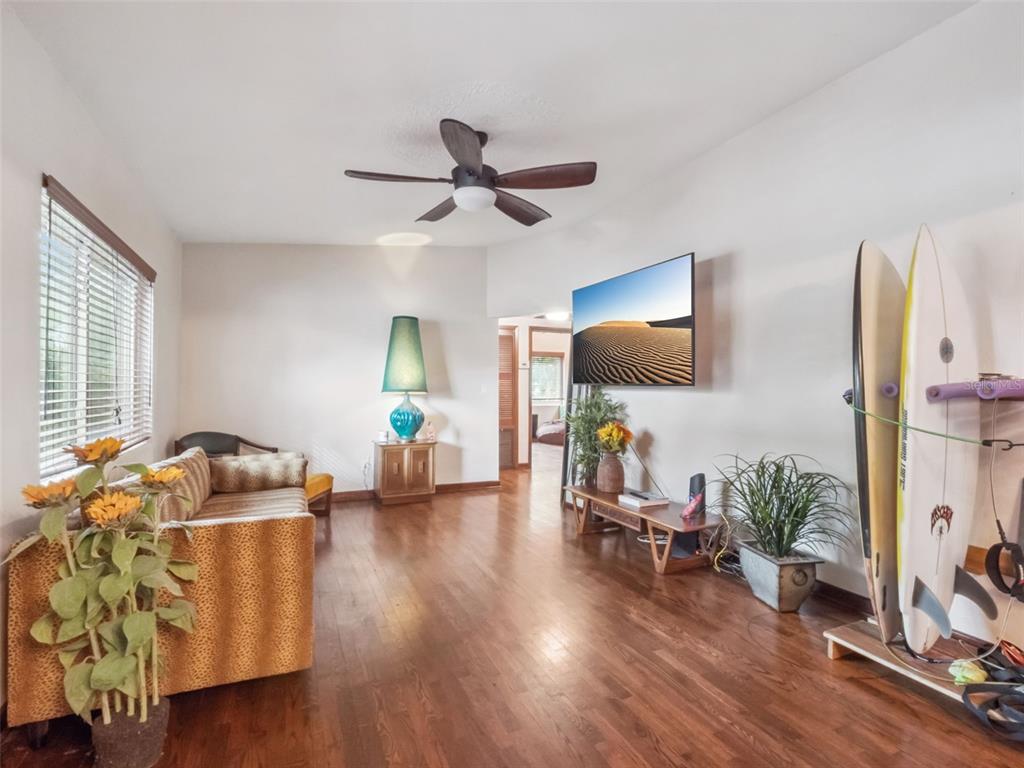 2819 Rogan Road Orlando, FL 32812 - Photo 5 of 28 a living room with furniture and a flat screen tv
