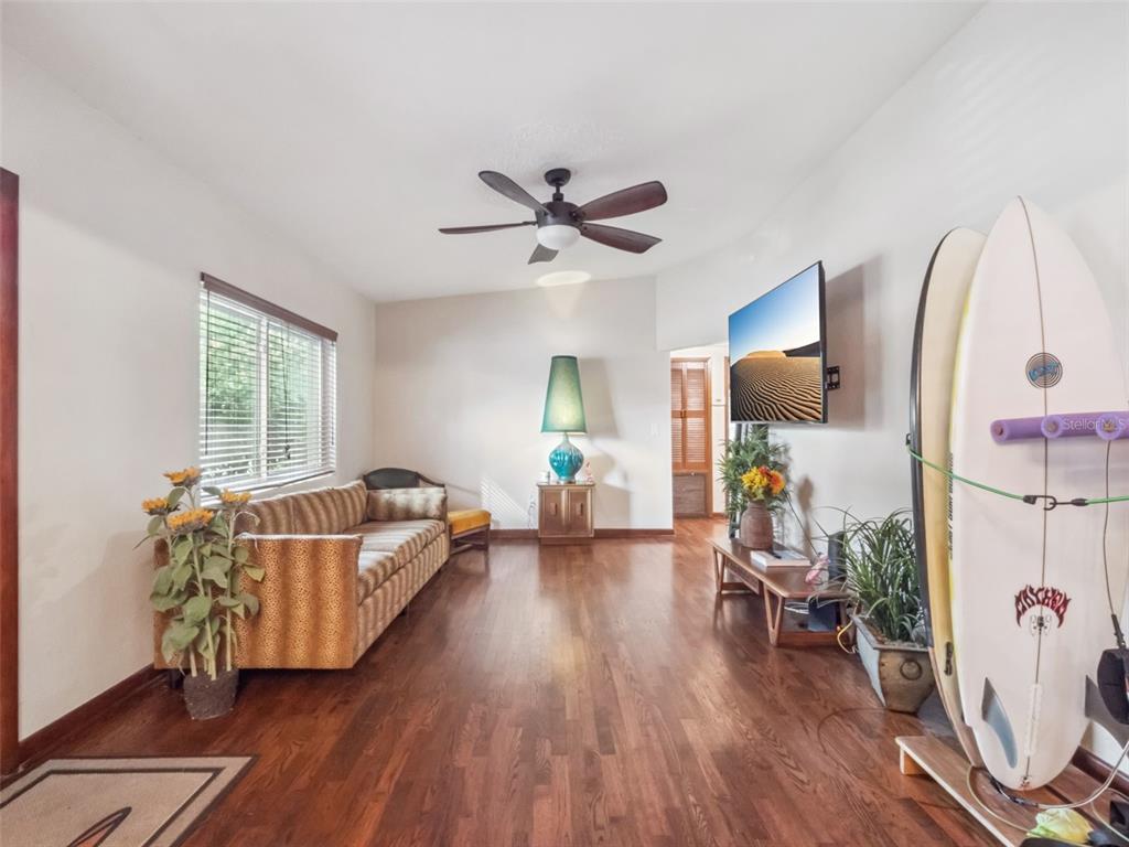 2819 Rogan Road Orlando, FL 32812 - Photo 6 of 28 a living room with furniture and wooden floor