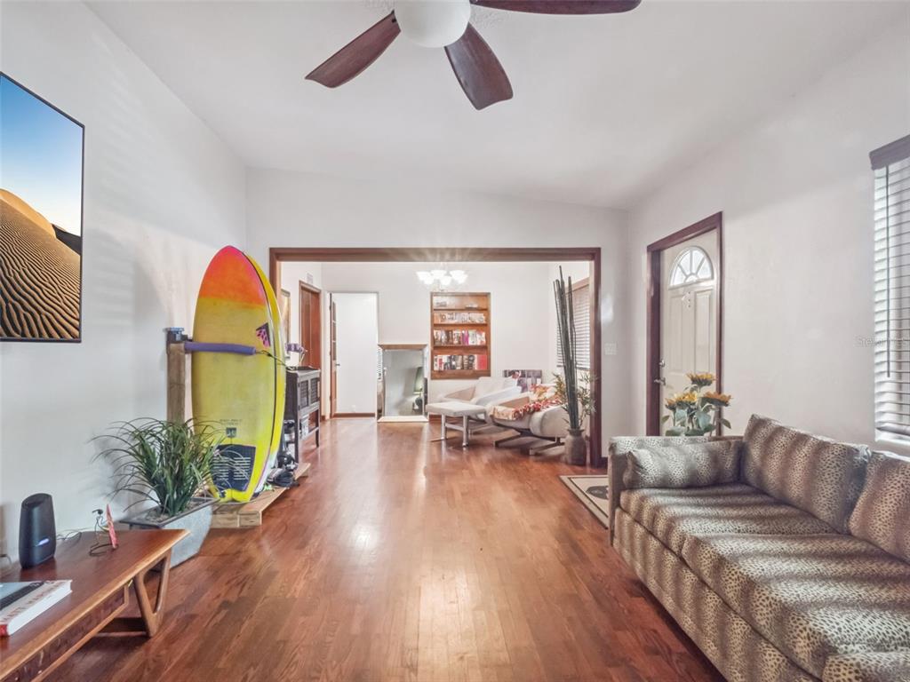 2819 Rogan Road Orlando, FL 32812 - Photo 7 of 28 a living room with furniture fireplace and wooden floor