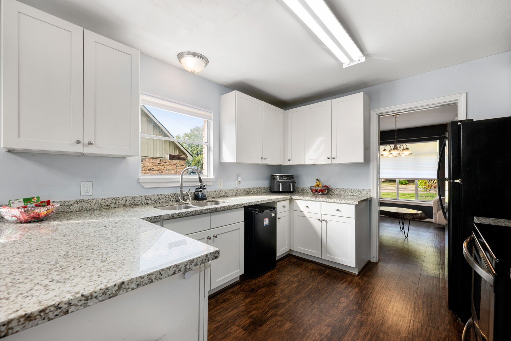 6019 Cartagena Street Houston, TX 77035 - Photo 14 of 29 a kitchen with a sink cabinets and window