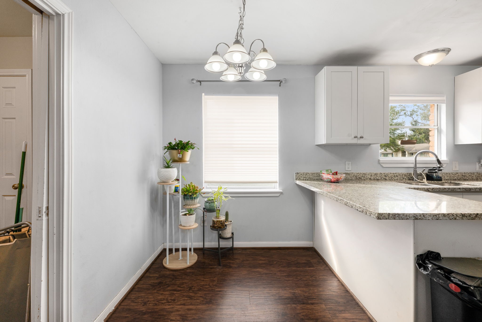 6019 Cartagena Street Houston, TX 77035 - Photo 17 of 29 a kitchen with a sink and chandelier