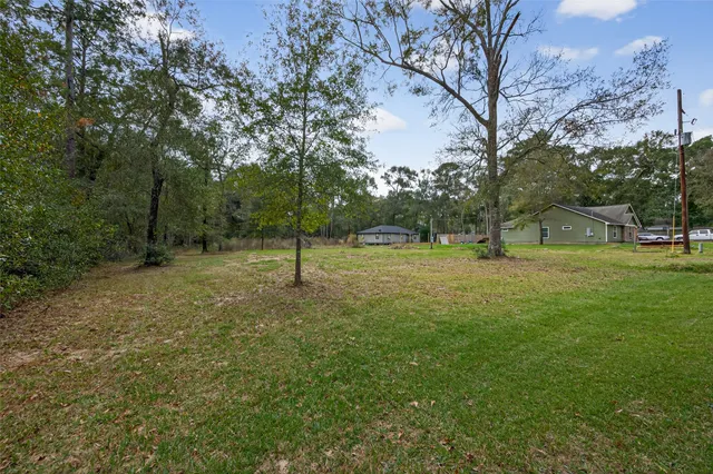 a view of outdoor space with deck and green space