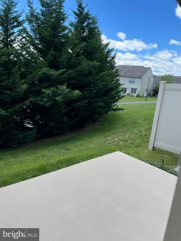 a view of a backyard with green space