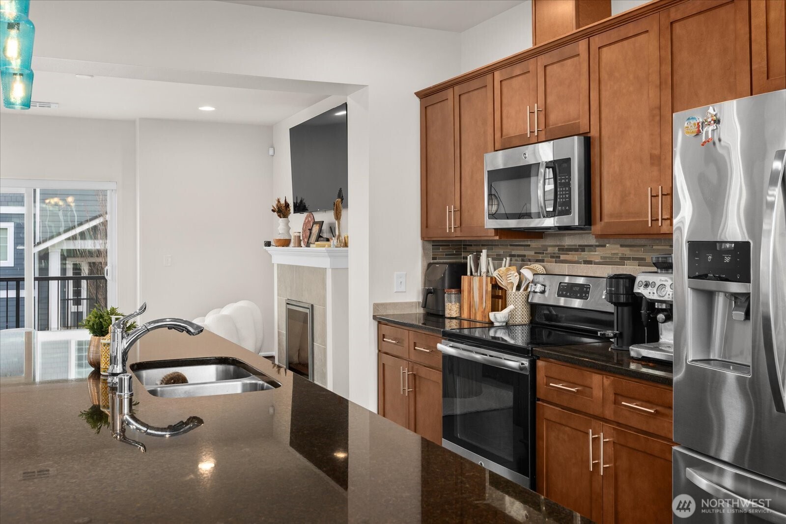3322 31st Drive Everett, WA 98201 - Photo 14 of 34 a kitchen with stainless steel appliances a stove a microwave and a refrigerator