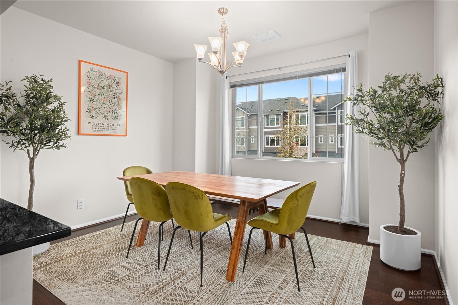 3322 31st Drive Everett, WA 98201 - Photo 15 of 34 a view of a dining room with furniture and a potted plant