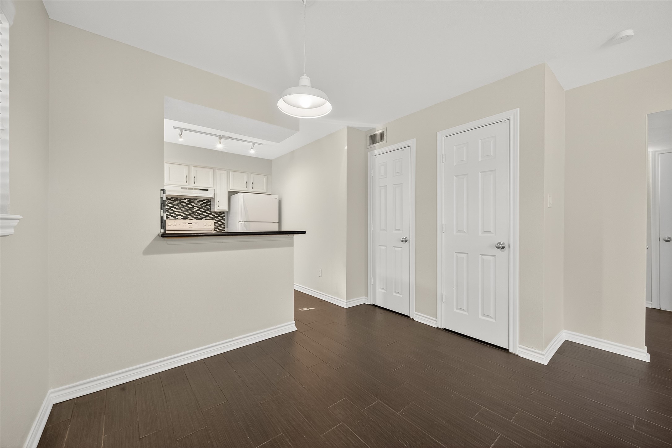 2020 Huldy Street, Unit 2 Houston, TX 77019 - Photo 15 of 34 a view of a room with wooden floor and white walls