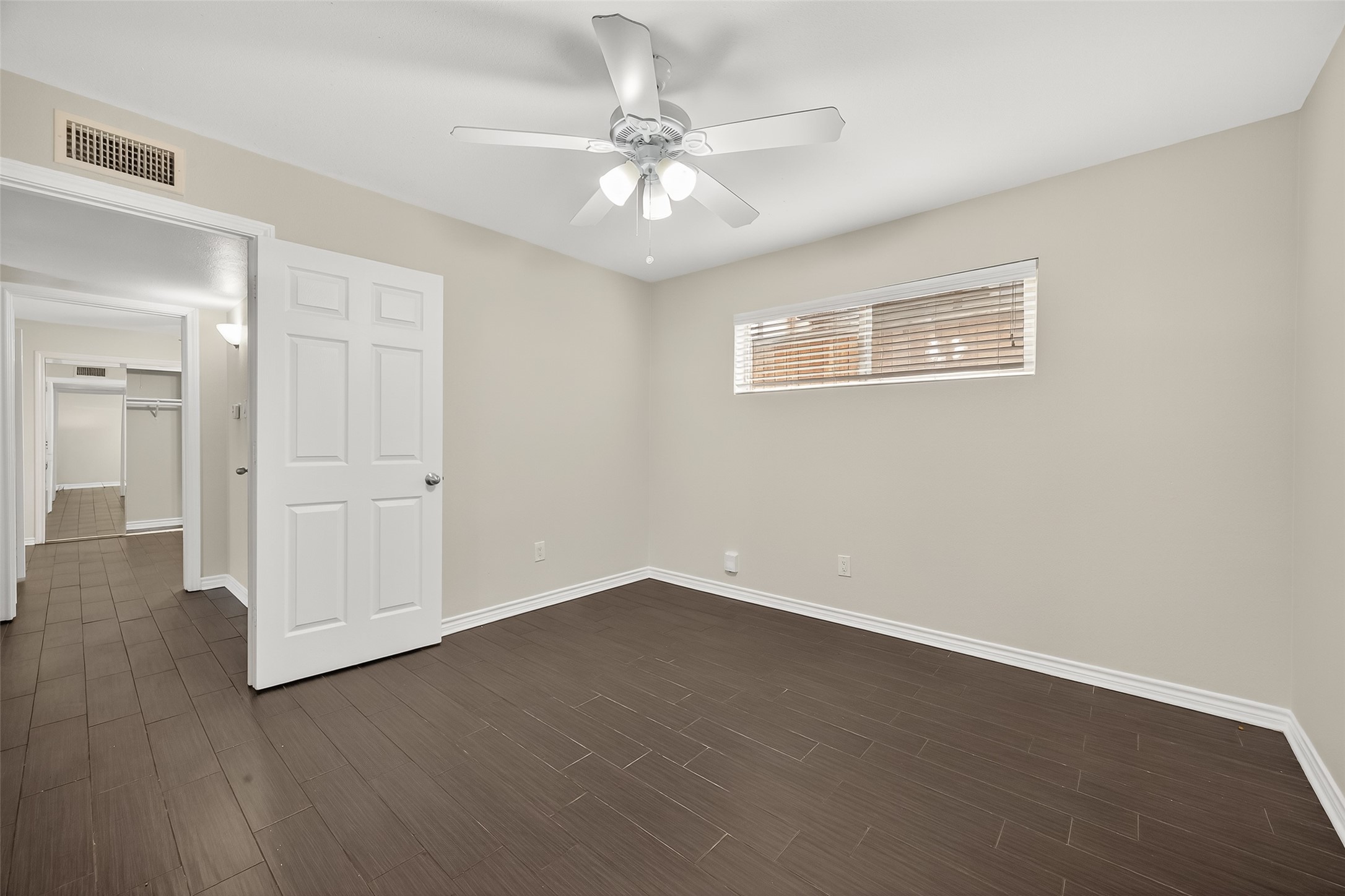2020 Huldy Street, Unit 2 Houston, TX 77019 - Photo 25 of 34 a view of an empty room with wooden floor