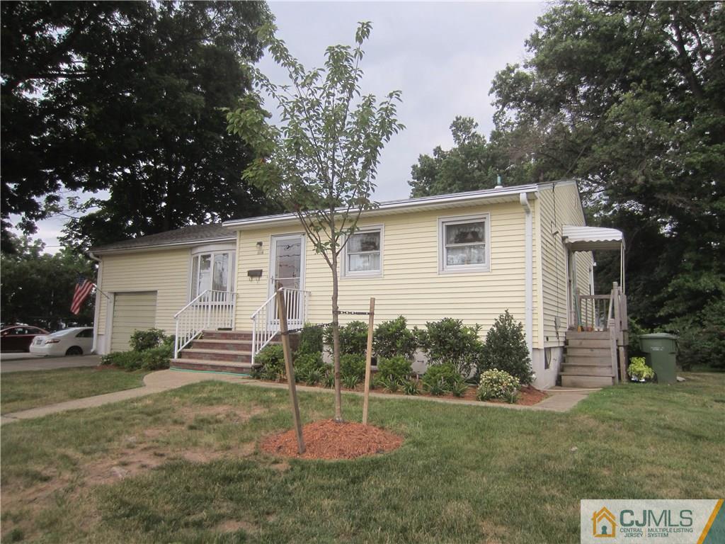 336 Old Post Road Edison, NJ 08817 - Photo 2 of 15 a backyard of a house with table and chairs