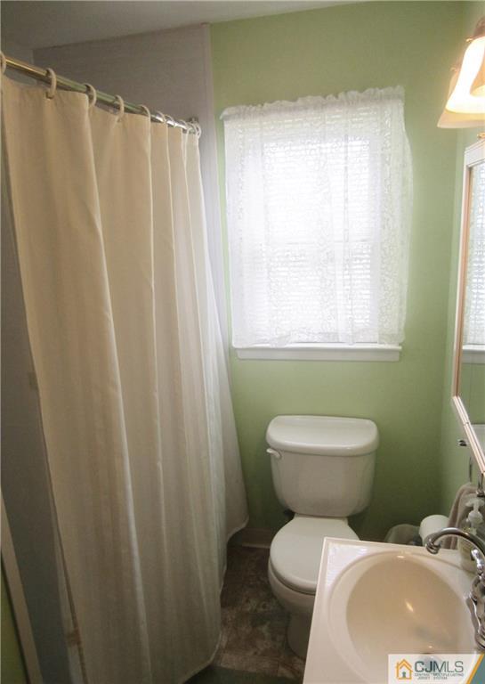 336 Old Post Road Edison, NJ 08817 - Photo 12 of 15 a white toilet sitting next to a bathroom sink