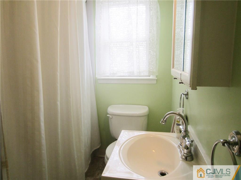 336 Old Post Road Edison, NJ 08817 - Photo 13 of 15 a bathroom with a sink and a toilet