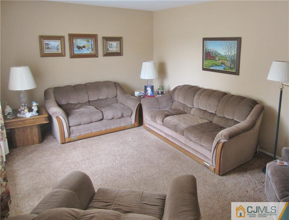 336 Old Post Road Edison, NJ 08817 - Photo 6 of 15 a living room with furniture and a couch