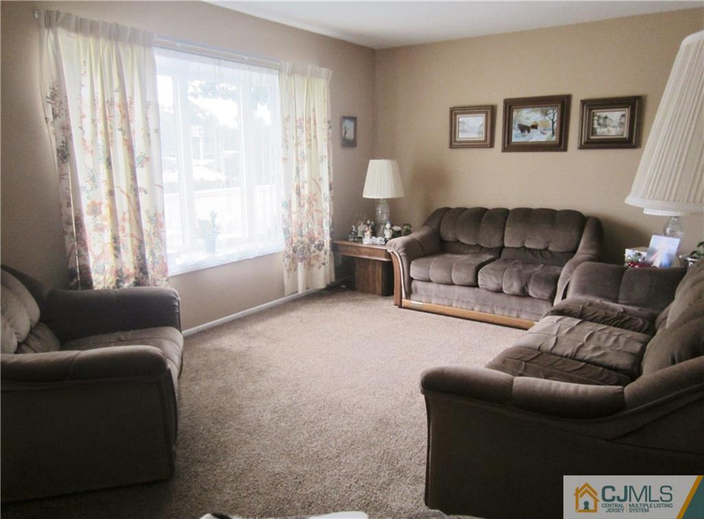 336 Old Post Road Edison, NJ 08817 - Photo 7 of 15 a living room with furniture and a window