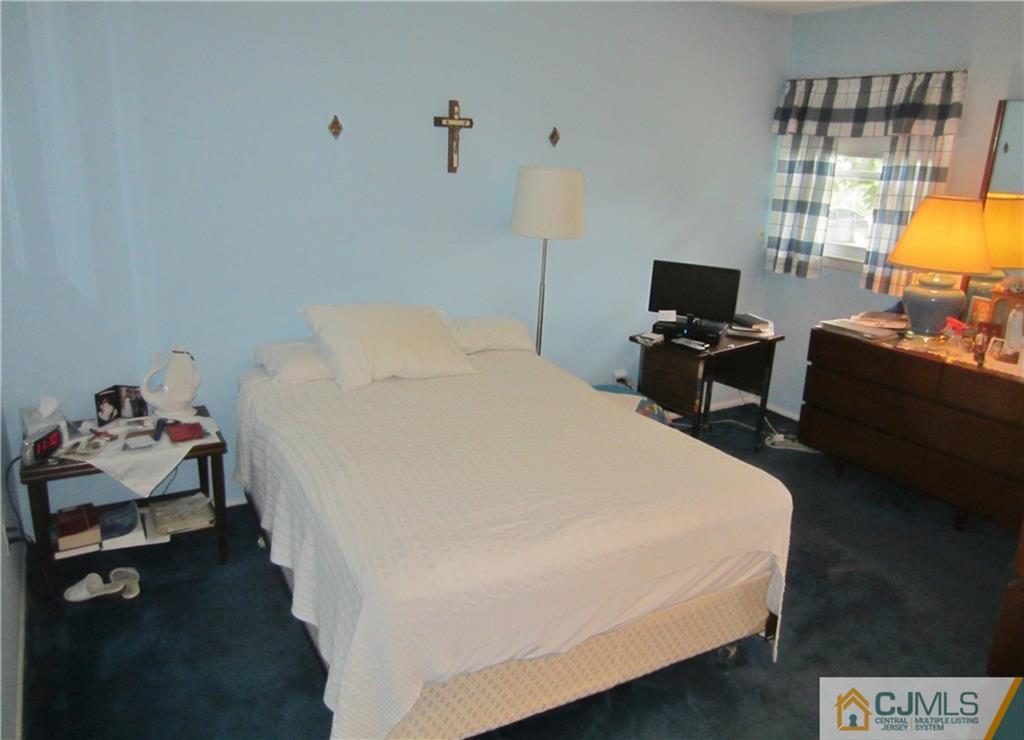 336 Old Post Road Edison, NJ 08817 - Photo 10 of 15 a bedroom with a bed and a couch