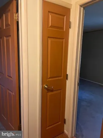 an entryway with wooden floor