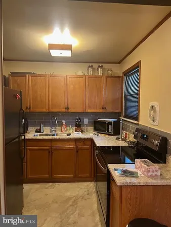 a kitchen with a sink and cabinets