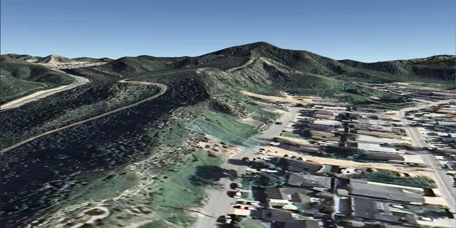 a view of a house with a mountain