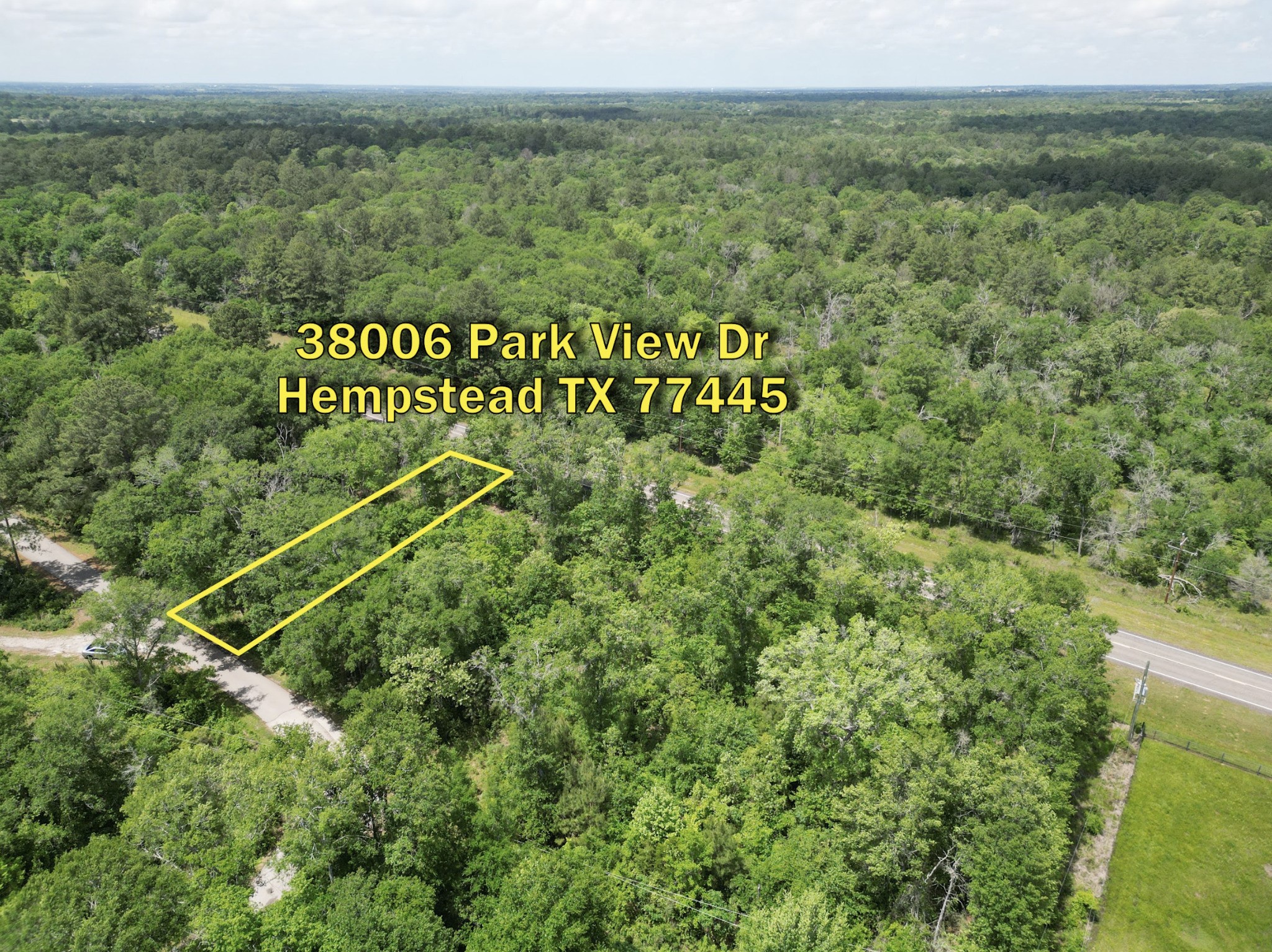 a view of a field with an ocean view