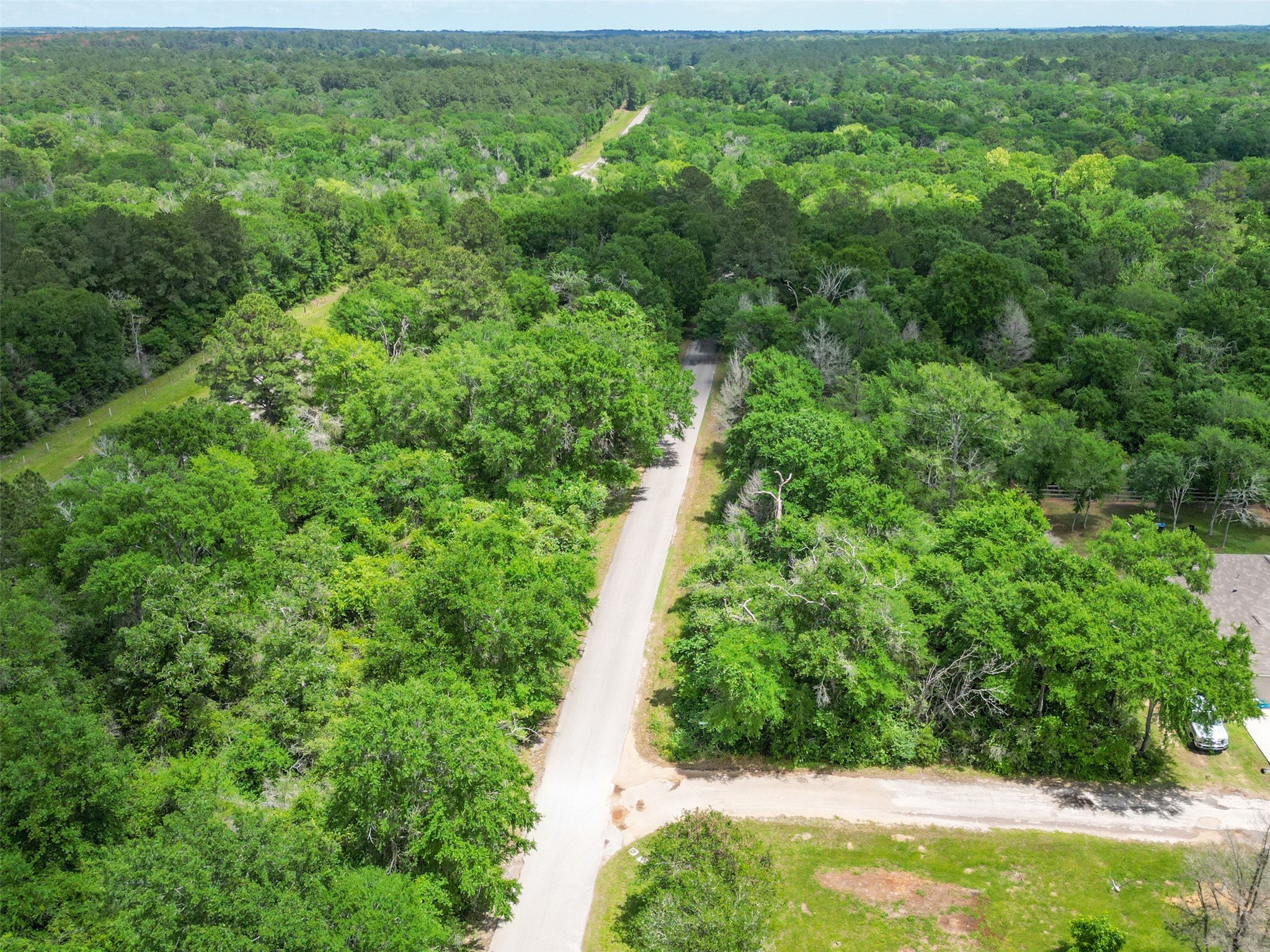 38006 Park View Drive Hempstead, TX 77445 - Photo 31 of 34 an aerial view of residential houses with outdoor space and trees