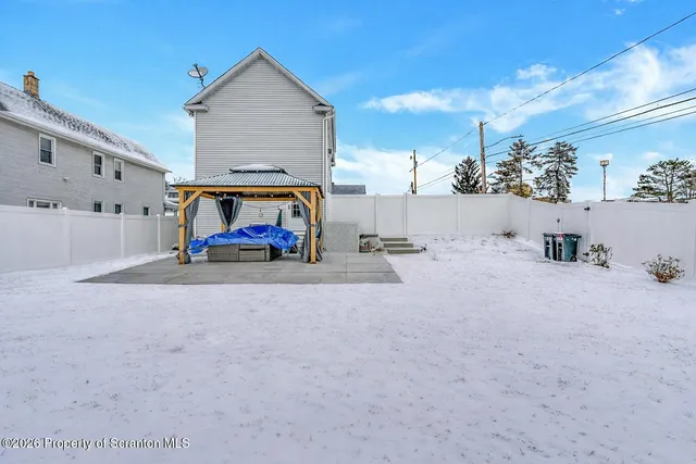 a view of a livingroom with furniture and a flat screen tv