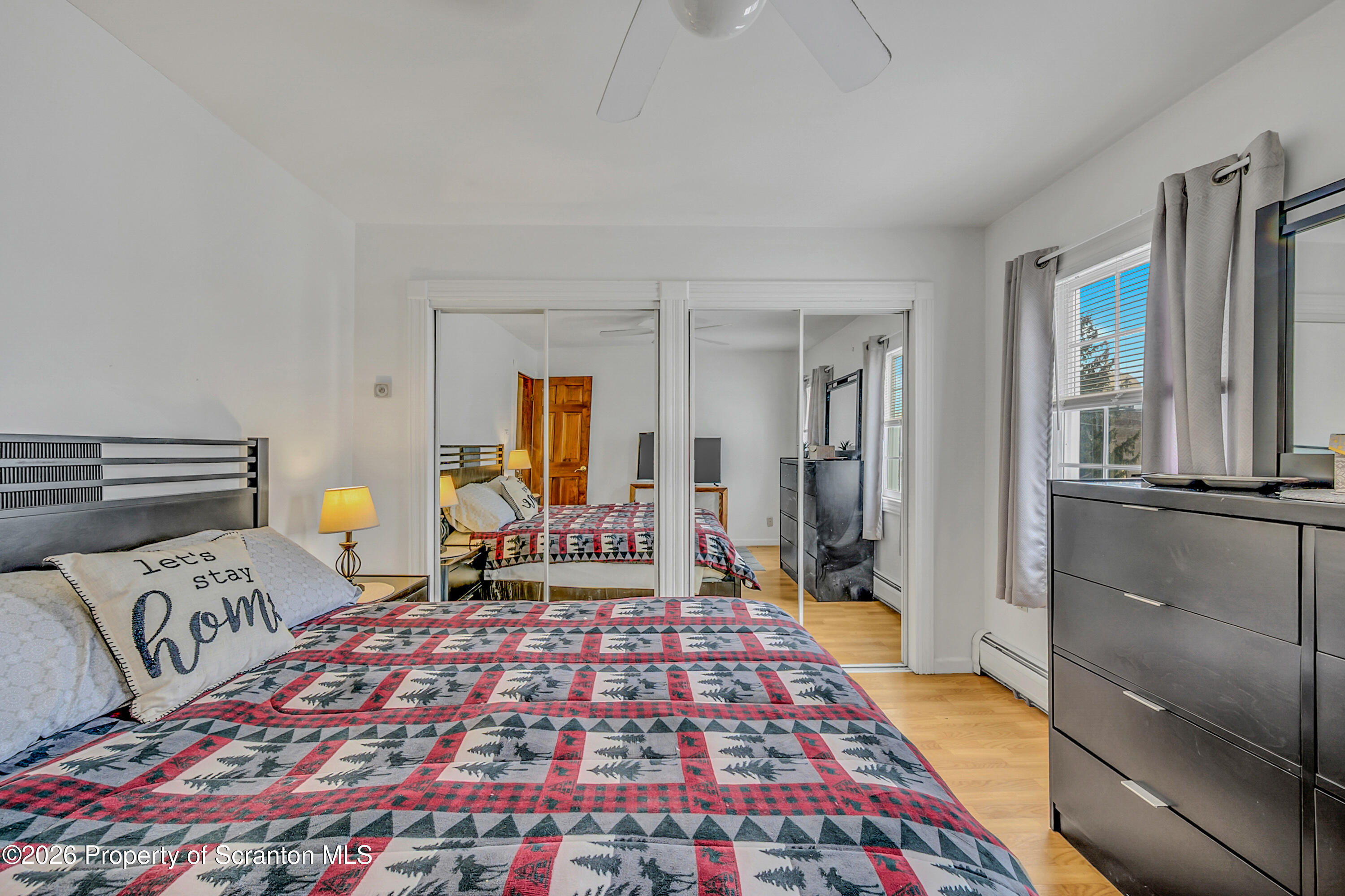 1803 Academy Street Scranton, PA 18504 - Photo 25 of 47 a bedroom with a bed and wooden floor